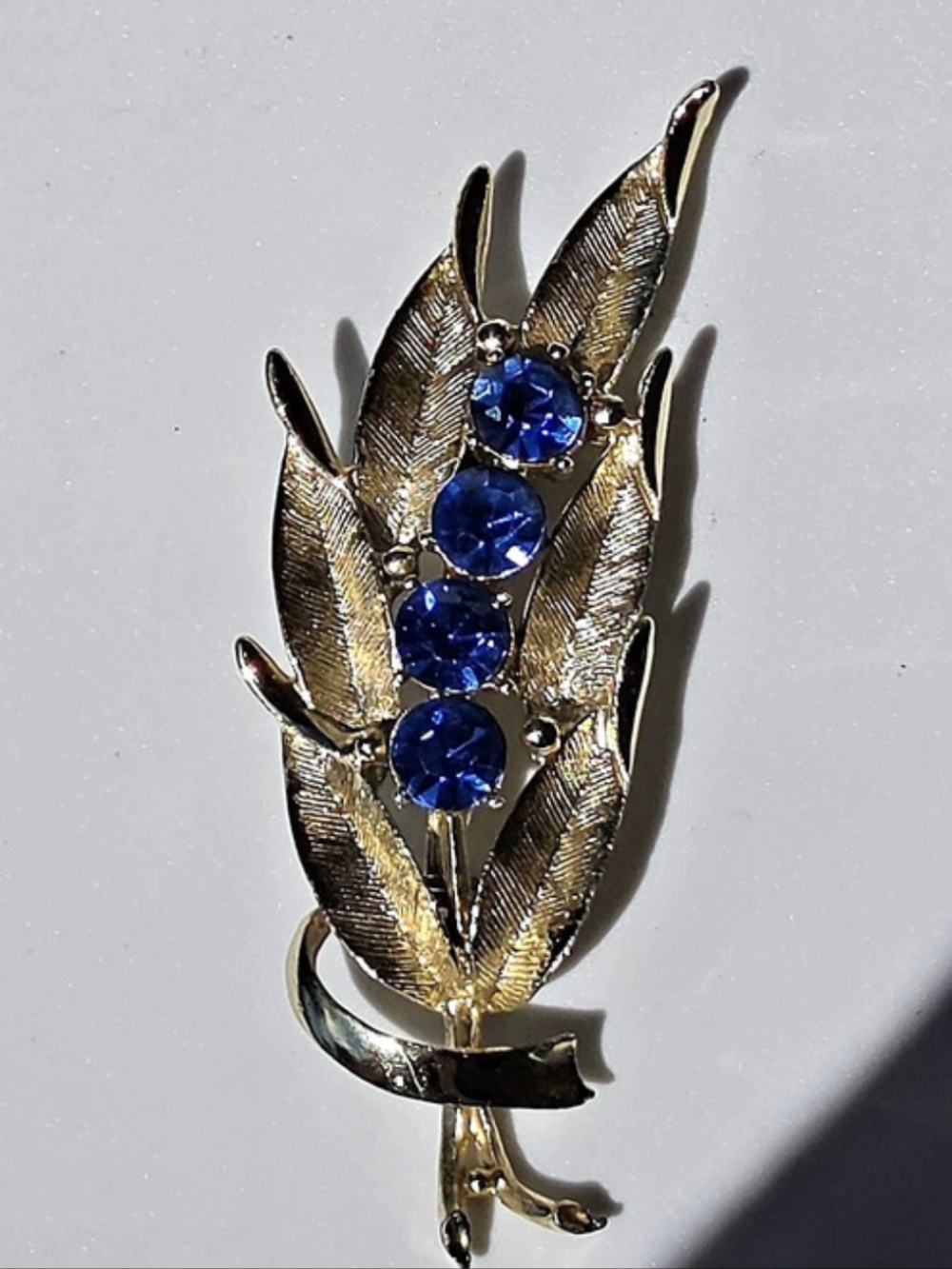 Vintage Leaf Brooch with Blue Rhinestones, Gold-tone